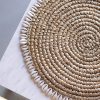 Banyu raffia placemat with cowrie shells