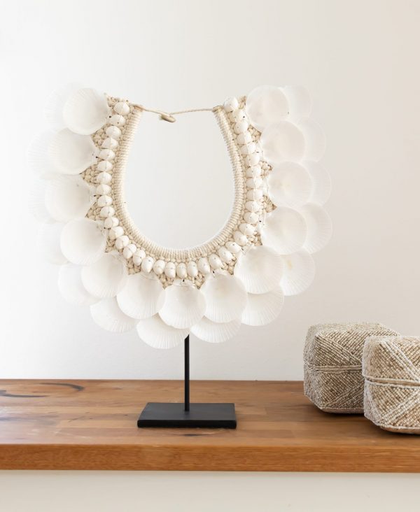 Shell necklace on stand